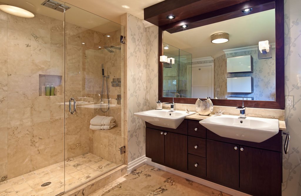 bathroom with walk-in shower double sink